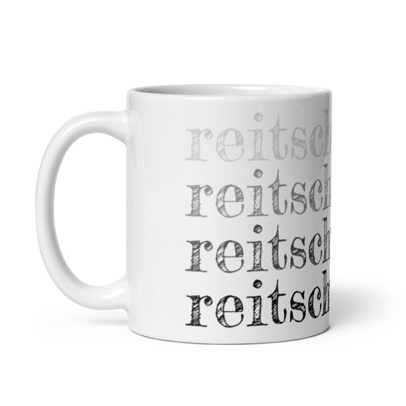 Tasse bedruckt mit schwarzen "reistchuster.de" Schriftzug im Rapport